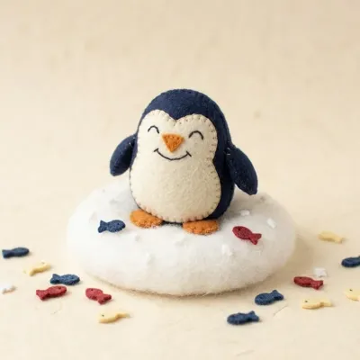 Chonky Penguin toe puppet in a cozy scene