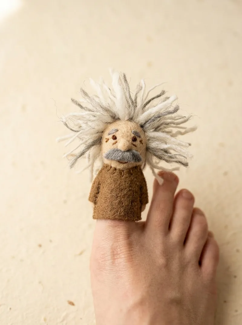 Albert Toe-stein toe puppet on a toe